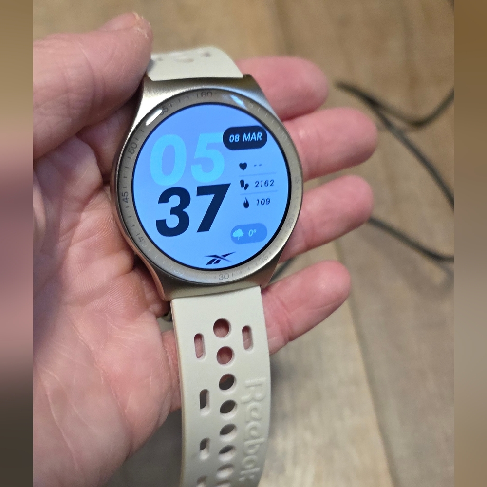 Reebok ($150) Fitness Smartwatch Beige Perforated Sport Band - Picture 2 of 6